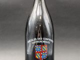 a bottle of wine that is sitting on a table