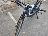 a bike that is parked in front of a stone wall