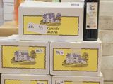 boxes of wine are stacked on top of each other on a table