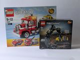two boxes of lego creator construction vehicles and a box of construction vehicles