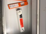 a metal cabinet with two orange boxes on top of it