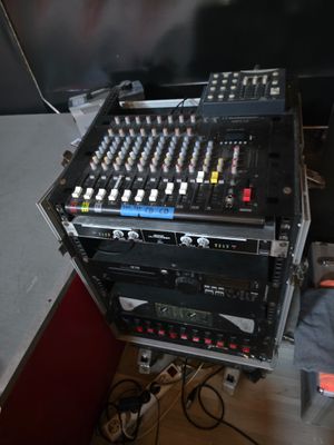 a lot of electronic equipment sitting on top of a table