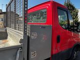 a red truck that is parked on the side of the road