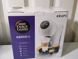 packaging of a coffee machine sitting on top of a white table