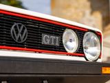 a close up of a vw gti grill on a car