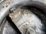 a close up of a tire with a wren on it