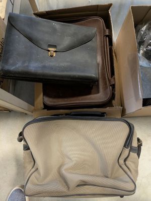 two bags sitting on top of each other in a box