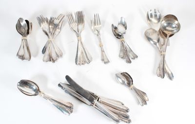 a lot of spoons and forks laid out on the table