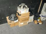 a pile of boxes that are sitting on the floor next to a wall