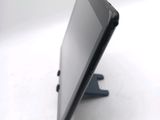 a tablet computer sitting on top of a stand