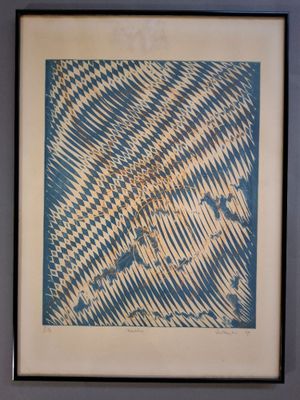 framed picture of a blue and white abstract painting on a wall