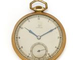 une montre de poche en or sur fond blanc, avec une trotteuse bleue