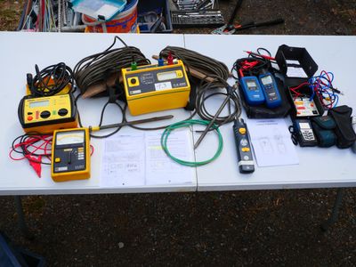 many different types of electrical equipment on a table