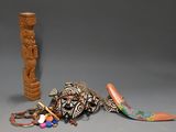 a small wooden object next to a large wooden object