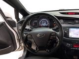 a dashboard of a car with a steering wheel and a dash board