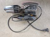 a corded drill and a corded cord on the ground
