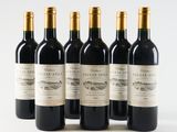 six bottles of red wine lined up in a row