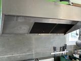 a stove with pots and pans on it in a kitchen