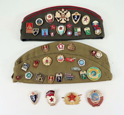 several military badges and badges are laid out on a bag