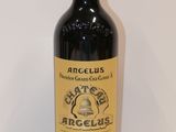 an image of a bottle of red wine sitting on a table