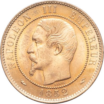 l'image d'une pièce d'or sur laquelle figure le visage d'un homme