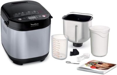 an image of a silver and black electric rice cooker next to a cup of coffee