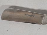 a knife that is laying on a table