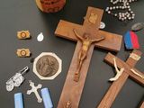 rosary, crucifix, and other religious items on a table