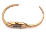 a close up of a gold bracelet with a lock on it