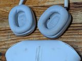 a pair of headphones and a sleeping mask on a wooden floor