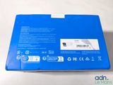 the back of a blue box with a white sticker on it
