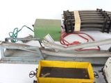 a lot of different types of train tracks on the table