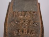 a close up of a metal object with writing on it