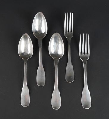 six silver spoons and a fork on a black surface
