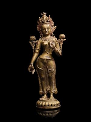 a gold statue of a woman holding a bird on a black background