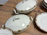 a table with a bunch of plates and bowls on it