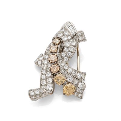 an image of a diamond and gold broochle, by van cleef