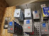many electronic devices on the wall in the store