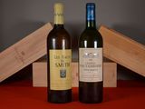 deux bouteilles de vin posées l'une à côté de l'autre sur une table