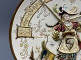 a decorative plate with a picture of a man holding a sword