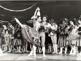 a black and white photo of a man and a woman in a ballet pose