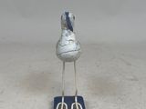 a small bird that is sitting on top of a book