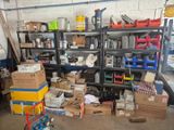 many boxes and boxes on a shelf in a garage