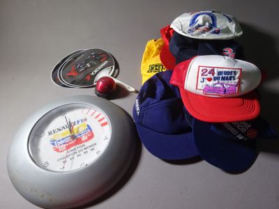 many hats and a clock on the table