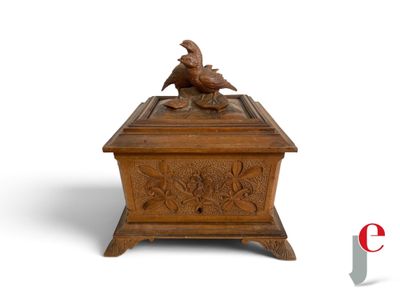 an image of a wooden box with a bird on it
