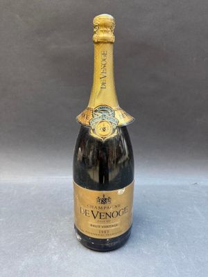 a bottle of champagne with a gold label on it