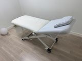 a massage table in the corner of a room