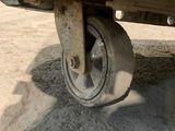 a close up view of a vehicle ' s wheels on the ground