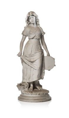 statue of a woman with a book in her hand