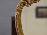 a mirror that is sitting on top of a table